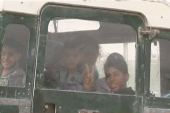 screengrab - displaced Libyan children in back of vehicle - from Sue Turton''s package