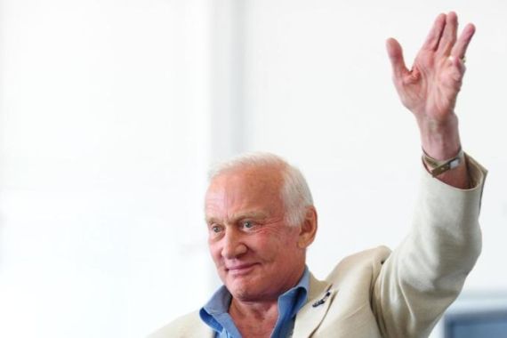 Former US Astronaut Buzz Aldrin waves to