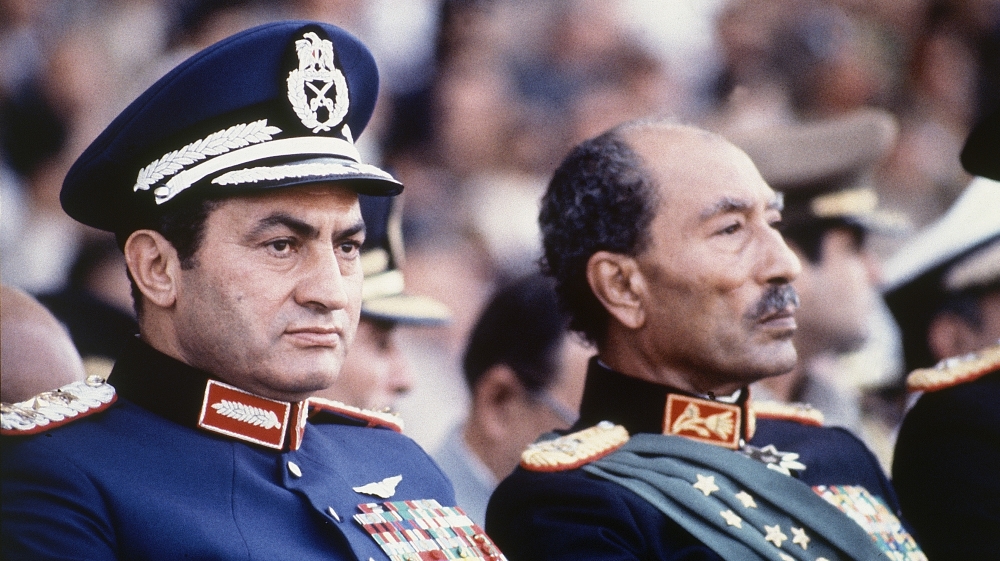 Hosni Mubarak and Anwar Sadat at a military parade on October 6, 1981. [AP]