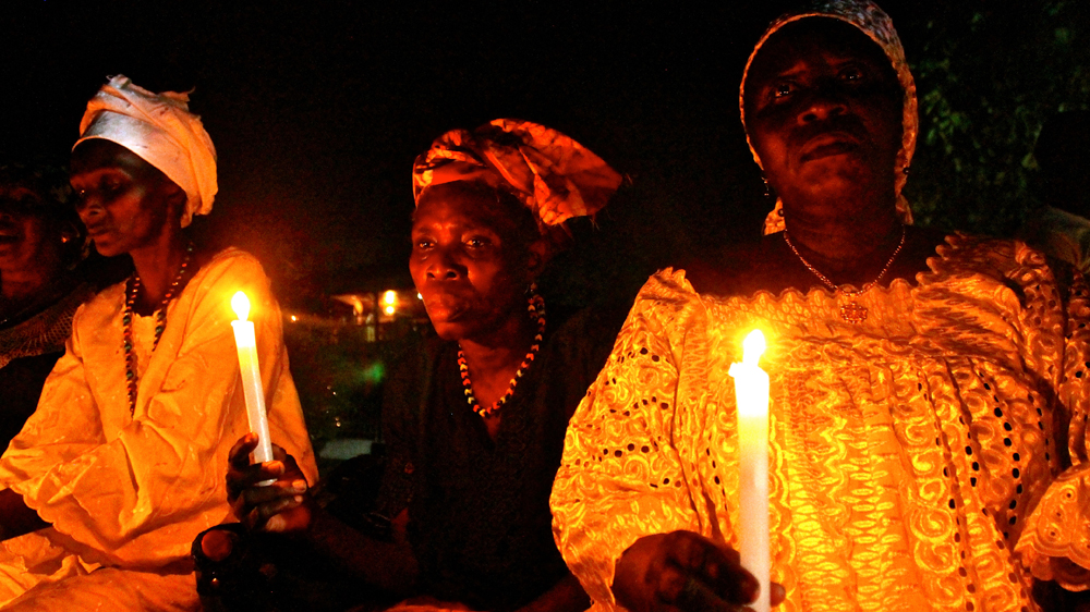 A candlelit vigil was held by healthcare workers to remember those who died in the outbreak [  Jo Lehmann/WaterAid  ]