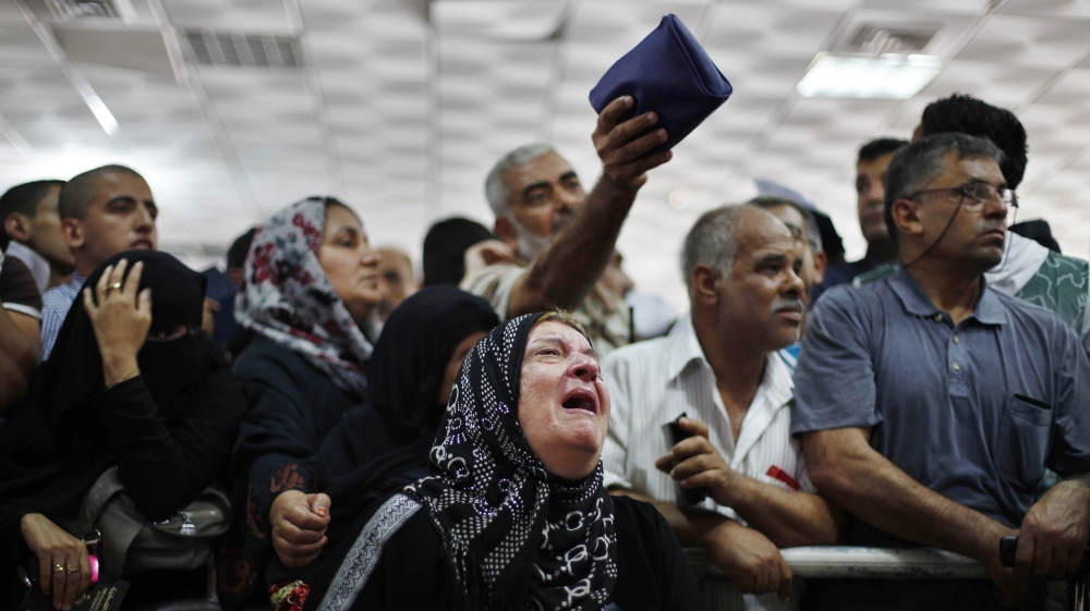 Palestinians in Gaza waiting at the Rafah border crossing, hoping to cross into Egypt [Reuters]