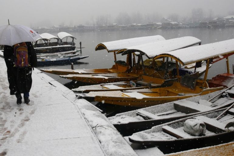 Dal lake during snowfall in Srinagar, the summer capital of Indian-adminstered Kashmir. [Farooq Khan EPA]