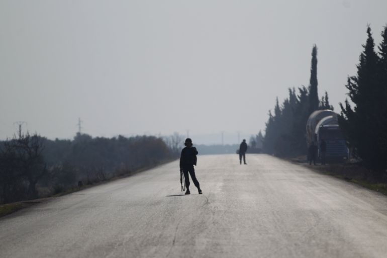Fighters from "Jaish al Fatah" secure a road in Idlib