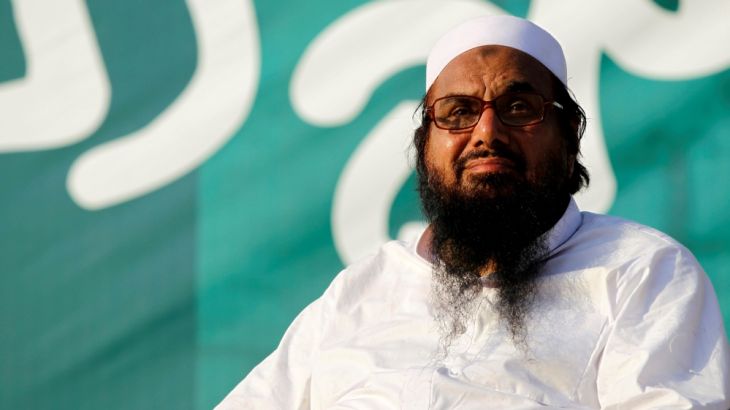 Hafiz Muhammad Saeed, chief of the banned Islamic charity Jamat-ud-Dawa, looks over the crowed as they end a "Kashmir Caravan" from Lahore with a protest in Islamabad