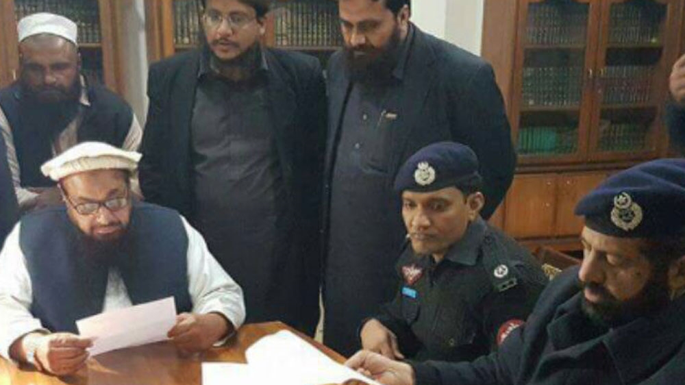 
Pakistani police placed Hafiz Muhammad Saeed, the alleged mastermind of coordinated attacks in Mumbai in 2008 that killed more than 160 people, under house arrest [Jamaat-ud-Dawa]

