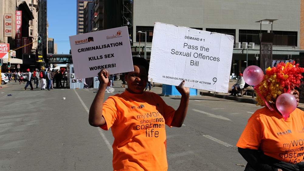 Sex workers protest against criminalisation of prostitution and gender-based violence outside the High Court in Johannesburg [Caelainn Hogan/Al Jazeera]