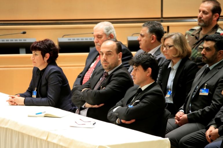 Head of opposition delegation al-Hariri listens during the speech of United Nations Special Envoy for Syria de Mistura in the context of the resumption of intra-Syrian talks, in Geneva