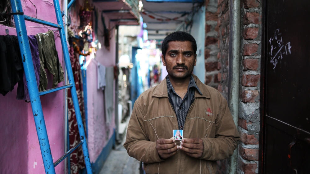 Yamuna Prasad believes his mother would still be alive if he had been able to withdraw money to pay for private medical care for her [Showkat Shafi/Al Jazeera]