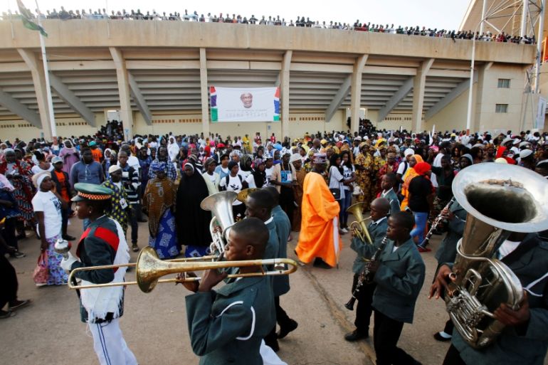 Supporters of Gambia President Barrow arrive for his swearing-in ceremony and the Gambia independence day at Independence Stadium, in Bakau