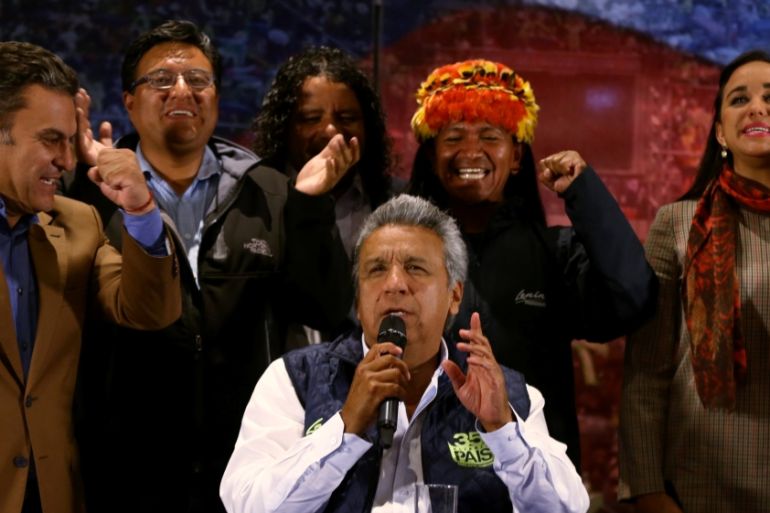 Lenin Moreno (C), presidential candidate of the ruling PAIS Alliance Party, gives a news conference accompanied by candidates for Ecuador''s Assembly in Quito