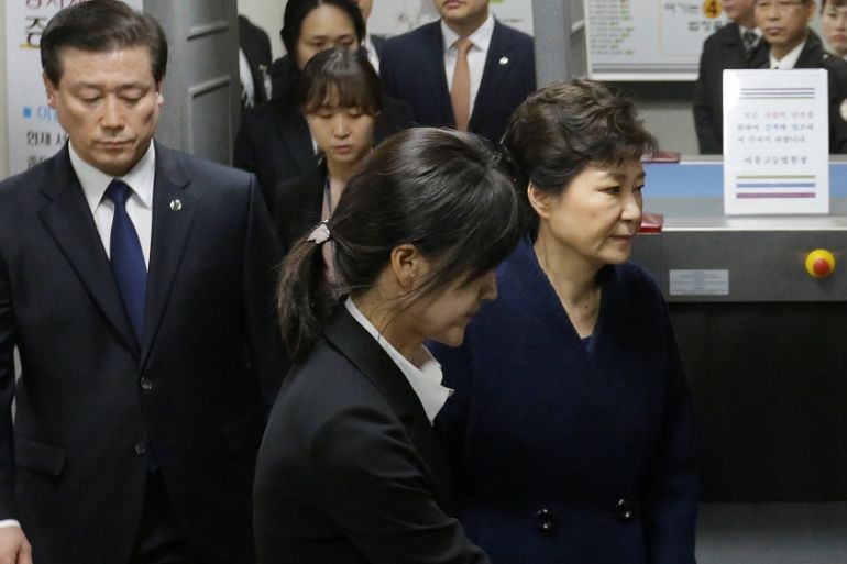 Ousted South Korean President Park Geun-hye leaves after hearing on a prosecutors'' request for her arrest for corruption at the Seoul Central District Court in Seoul, South Korea