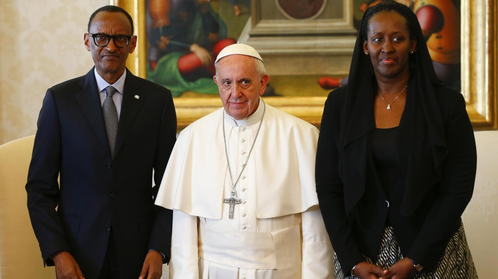 Pope Francis poses with Rwandan President Paul Kagame and his wife Jeannette during a private meeting at the Vatican on Monday [EPA]