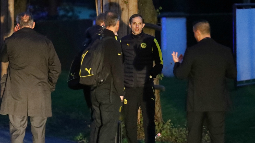 Borussia Dortmund coach Thomas Tuchel is seen by the team bus after the incident [Kai Pfaffenbach/Reuters]