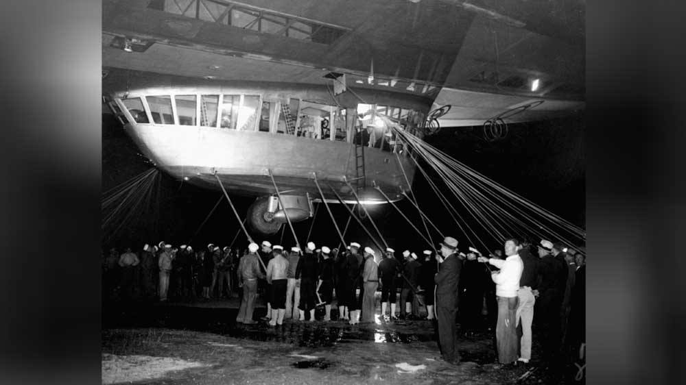 Spectators and ground crew surround the gondola of the Hindenburg as the lighter-than-air ship prepared to depart from Lakehurst [AP]