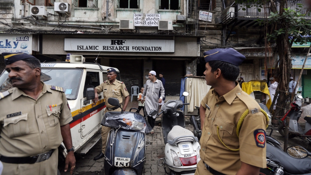 Mumbai Police personnel outside the closed office of the Islamic Research Foundation [EPA]