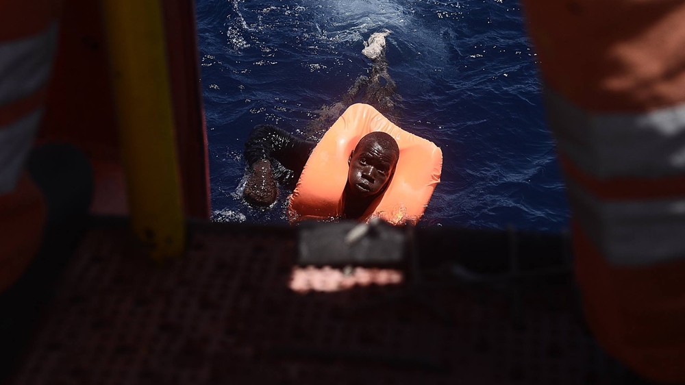 When the shooting started, refugees jumped into the water [Kenny Karpov/SOS Mediterranee]