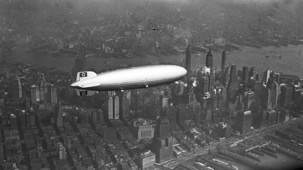 The German zeppelin Hindenburg flies over Manhattan on May 6, 1937, few hours before the fatal crash [AP]