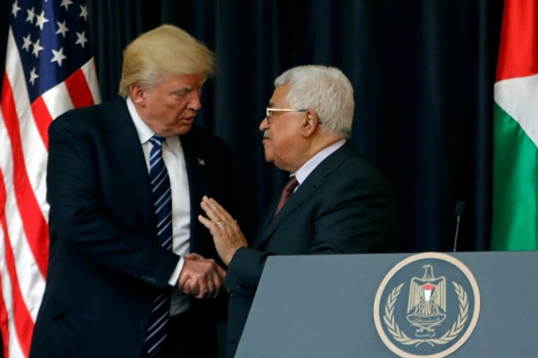 U.S. President Donald Trump shakes hands with Palestinian President Mahmoud Abbas during a joint news conference at the presidential headquarters in the West Bank town of Bethlehem