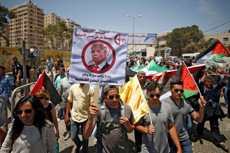 A Palestinian demonstrator holds