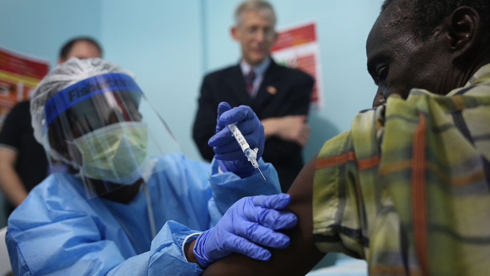 A nurse administers an injection on the first day of the Ebola vaccine study being conducted at Redemption Hospital, formerly an Ebola centre, on February 2, 2015, in Monrovia, Liberia. [John Moore/Getty Images] 