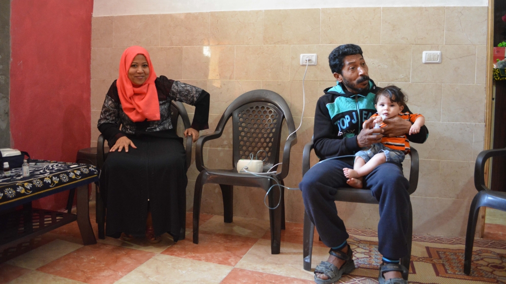 Manar Bahtiti, left, works in the administration of Gaza City's Al Ahli Hospital [Mersiha Gadzo/Al Jazeera]