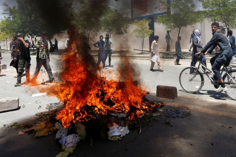 Afghan protesters set fire during protest in Kabul