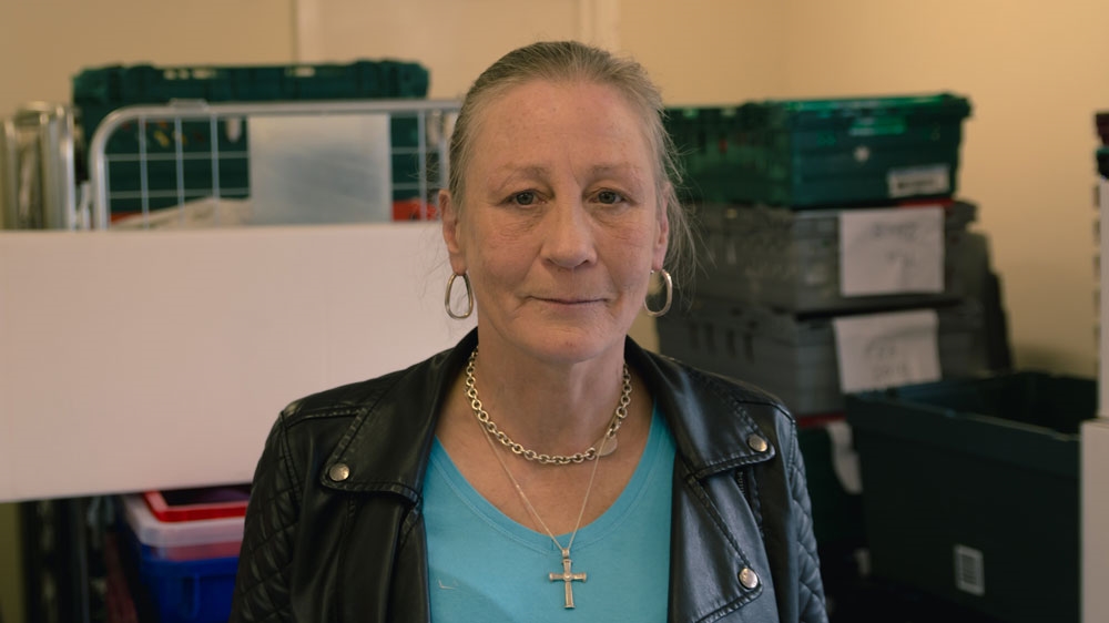 Debbie is collecting food for her daughter, who suffers from post-natal depression, but is too embarrassed to use a food bank. An estimated 2,000 food banks operate in the UK [Ruairi Casey/Al Jazeera]