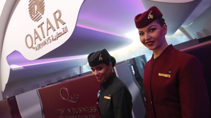 Qatar Airways stewardesses pose at the International Tourism Trade Fair ITB in Berlin
