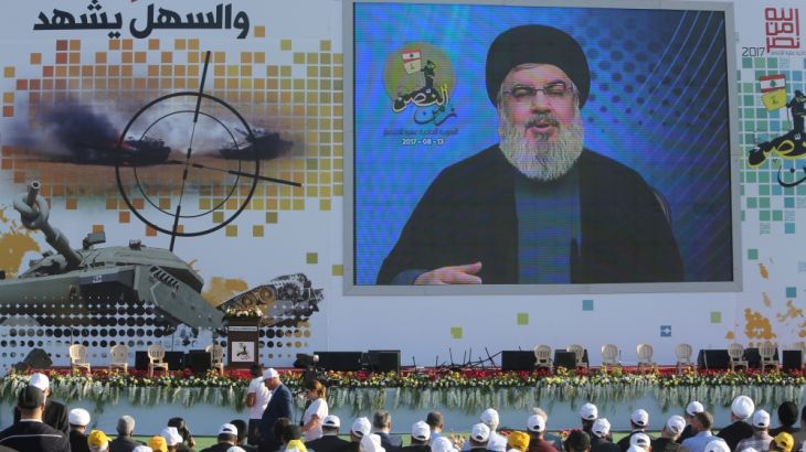 Lebanon''s Hezbollah leader Sayyed Hassan Nasrallah speaks via a screen during a rally marking the 11th anniversary of the end of Hezbollah''s 2006 war with Israel, in the southern village of Khiam