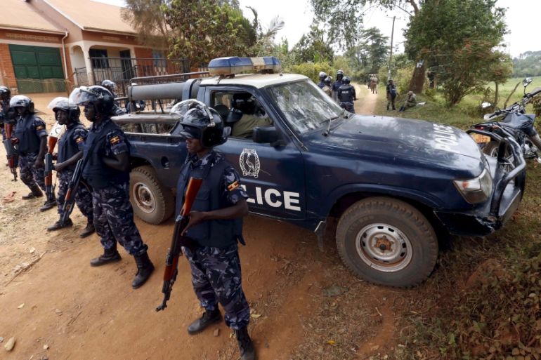 Riot police block driveway leading to home of Besigye in Kampala on the outskirts of Uganda''s capital Kampala