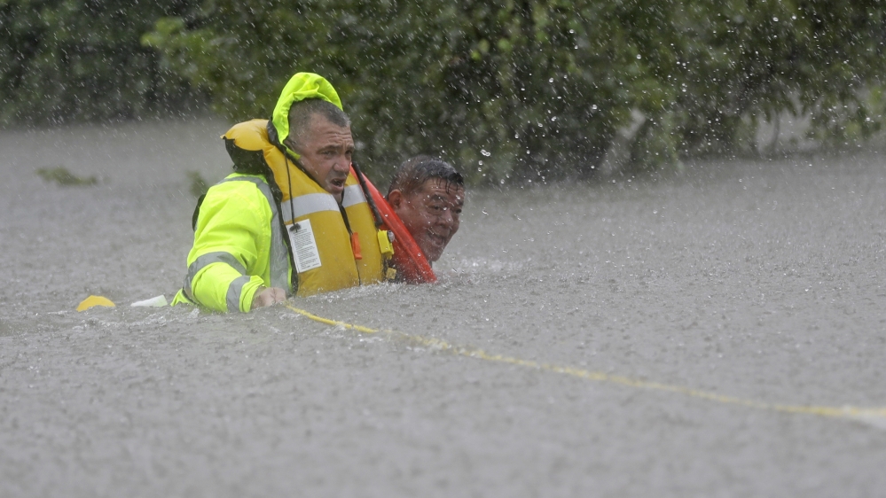 Hundreds of rescue workers have joined rescue operations in Texas [David J Phillip/AP]