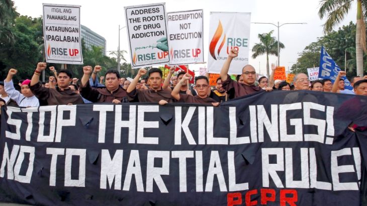Protestors stage a protest rally against extrajudicial killings during a National day of Protest at Luneta Park in metro Manila