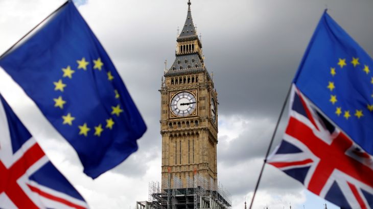 Union Flags and European Union flags fly near the Elizabeth Tower, housing the Big Ben bell, during the anti-Brexit ''People''s March for Europe'', in Parliament Square in central London