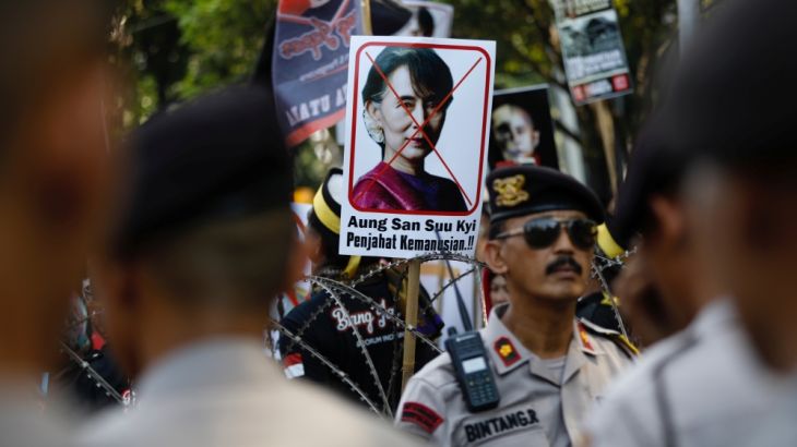 A placard with the picture of Aung San Suu Kyi, accusing her of crimes against humanity, is seen at a rally near the Myanmar embassy during a protest in Jakarta