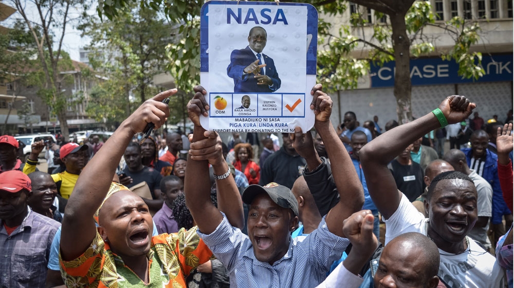 Supporters of Kenya's opposition celebrate after the Supreme Court ordered a re-run of the August 8 presidential poll [Simon Maina/AFP]