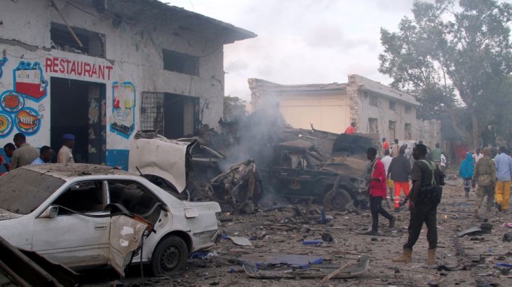 General view shows the aftermath of a suicide car bombing at the gate of Naso Hablod Two Hotel in Mogadishu