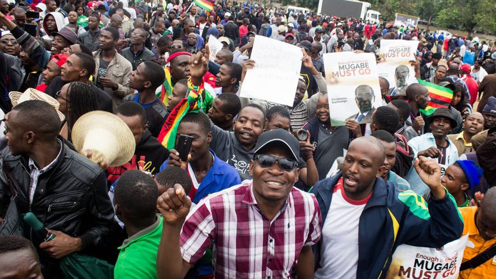 Thousands turned out to join Saturday's rally, which was called for by the Zimbabwe National Liberation War Veterans Association and backed by the army [Tendai Marima/Al Jazeera]