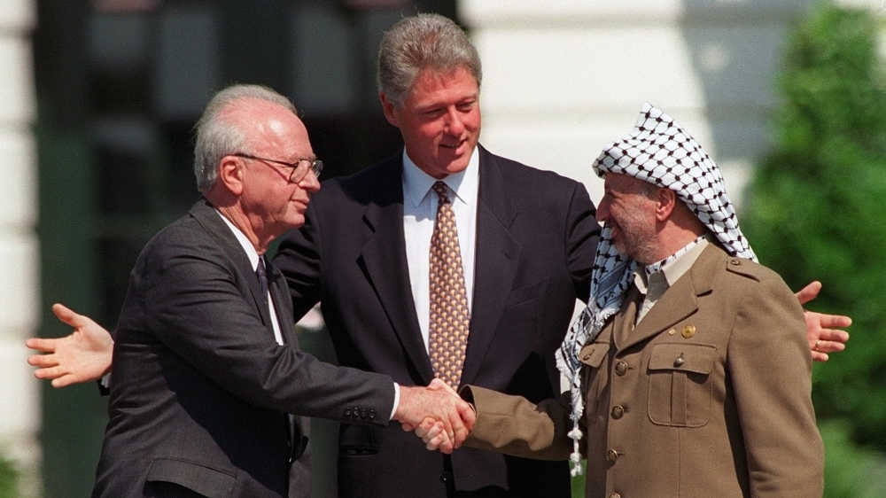President Bill Clinton presides over ceremonies marking the signing of the 1993 peace accord between Israel and the Palestinians on the White House lawn with Israeli Prime Minister Yitzhak Rabin and PLO Chairman Yasser Arafat [File: AP]
