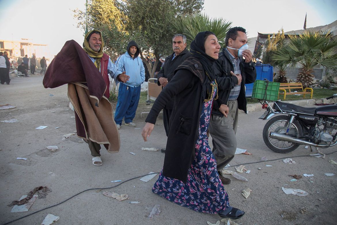 People react following an earthquake in Sarpol-e Zahab county in Kermanshah, Iran. REUTERS/Tasnim News Agency