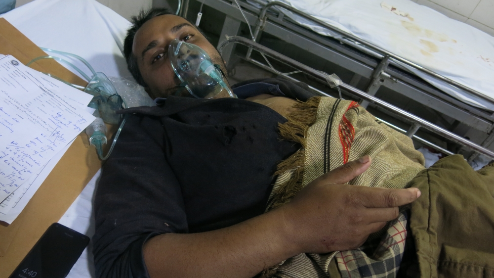 Liaquat Kazmi said he was beaten by police while standing outside his home [Al Jazeera]