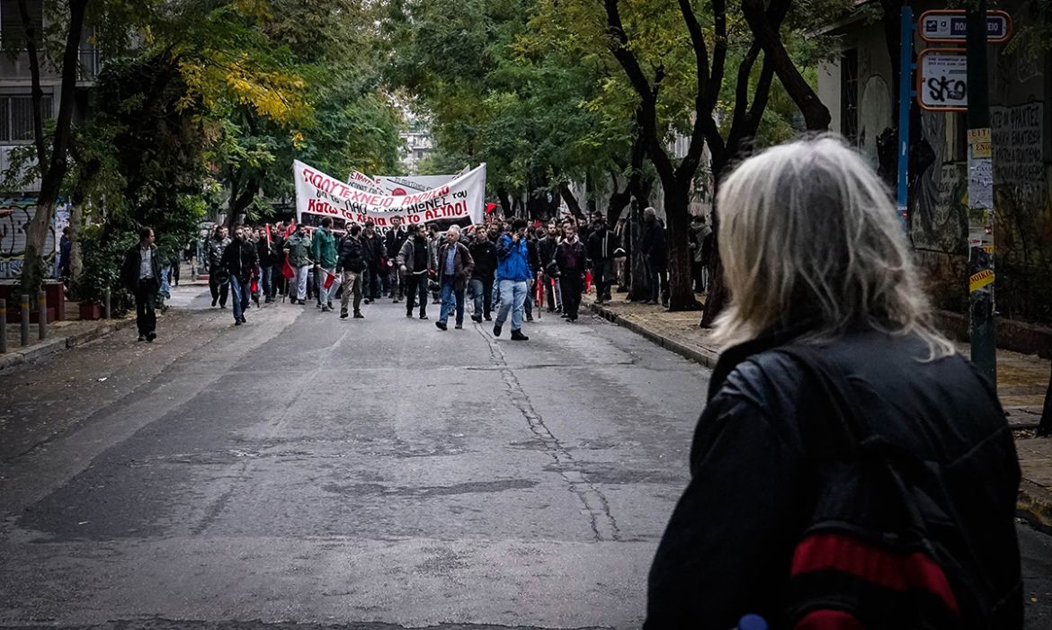 Communists marched to enter the Polytechnic campus after a group of anarchists had barricaded it for more than 24 hours. [Patrick Strickland/Al Jazeera]