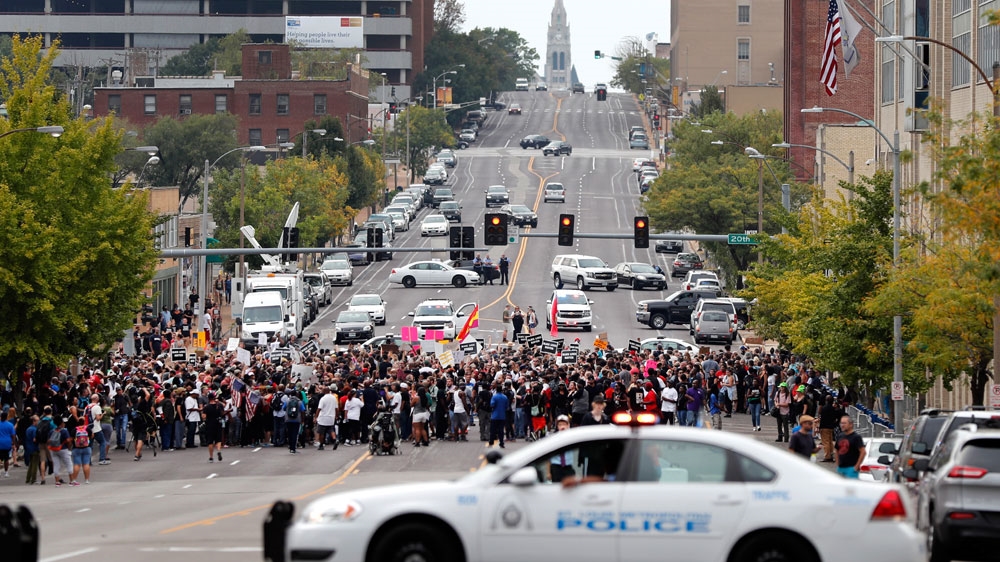 Demonstrators protest outside the St Louis Police Department in September [File: Jeff Roberson/AP Photos]