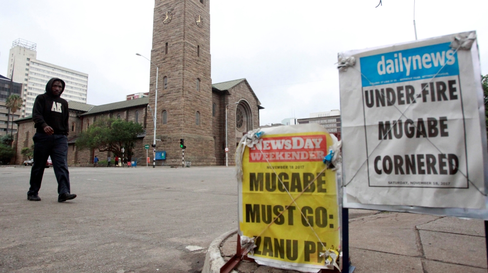 Newspaper billboards are seen in Harare on Saturday [Philimon Bulawayo/Reuters]