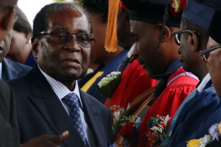 Zimbabwe President Robert Mugabe attends a university graduation ceremony in Harare