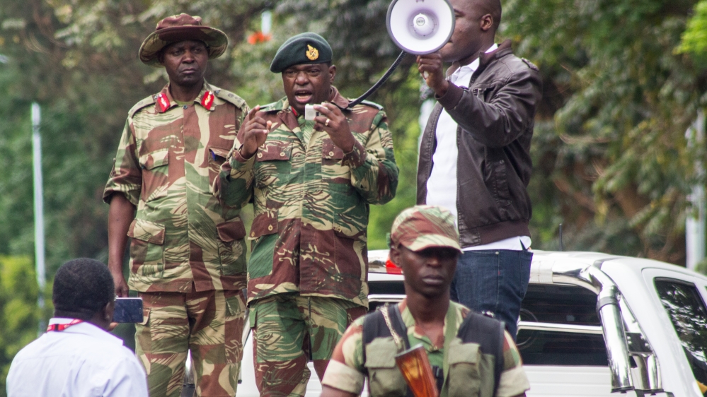 Major General Sibusiso Moyo addresses the crowd in Harare [Tendai Marima/Al Jazeera]