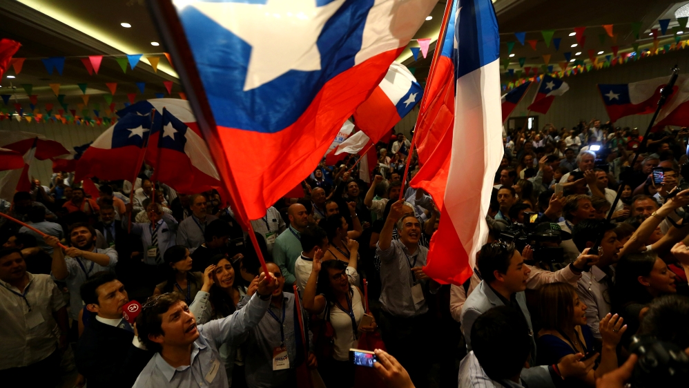 Pinera supporters celebrate after hearing the results [Ivan Alvarado/Reuters]