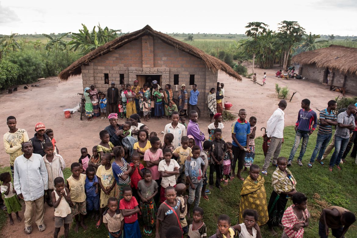 The rain breaks, and dozens of displaced families spill outside the Church of Light. Many of the displaced communities in Congo believe the international community has abandoned them. Despite the Unit