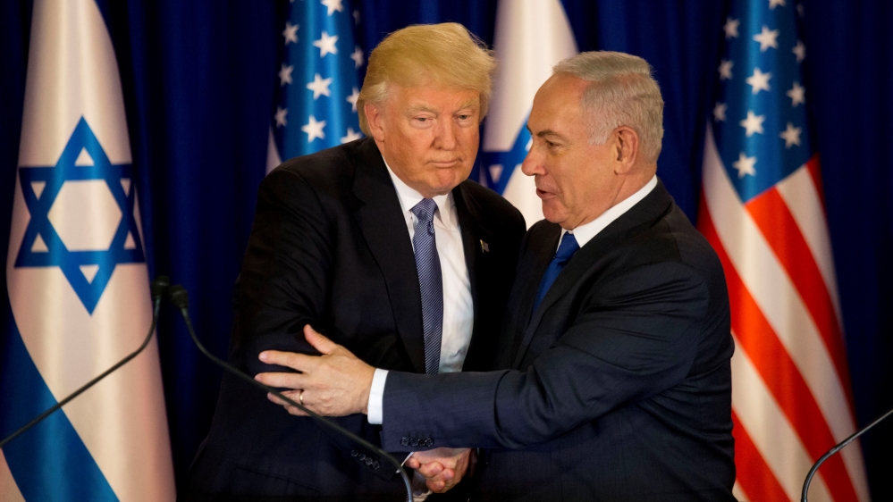 US President Donald Trump and Israel's Prime Minister Benjamin Netanyahu shake hands as they deliver remarks before a dinner at Netanyahu's residence in Jerusalem [Ariel Schalit/Reuters]
