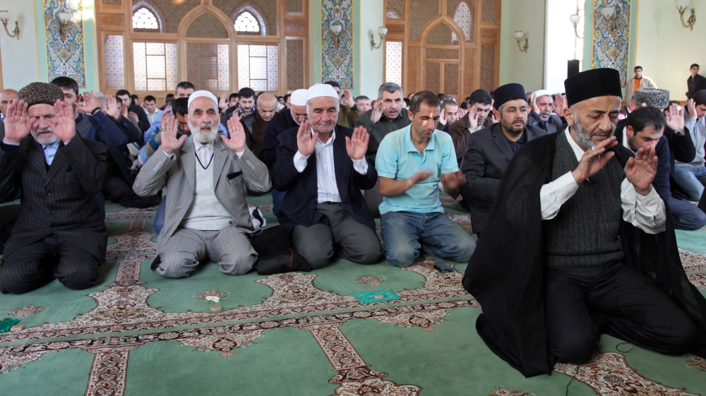 Azerbaijani worshippers perform Eid al-Adha prayers [Manoocher Deghati/AP Photo]