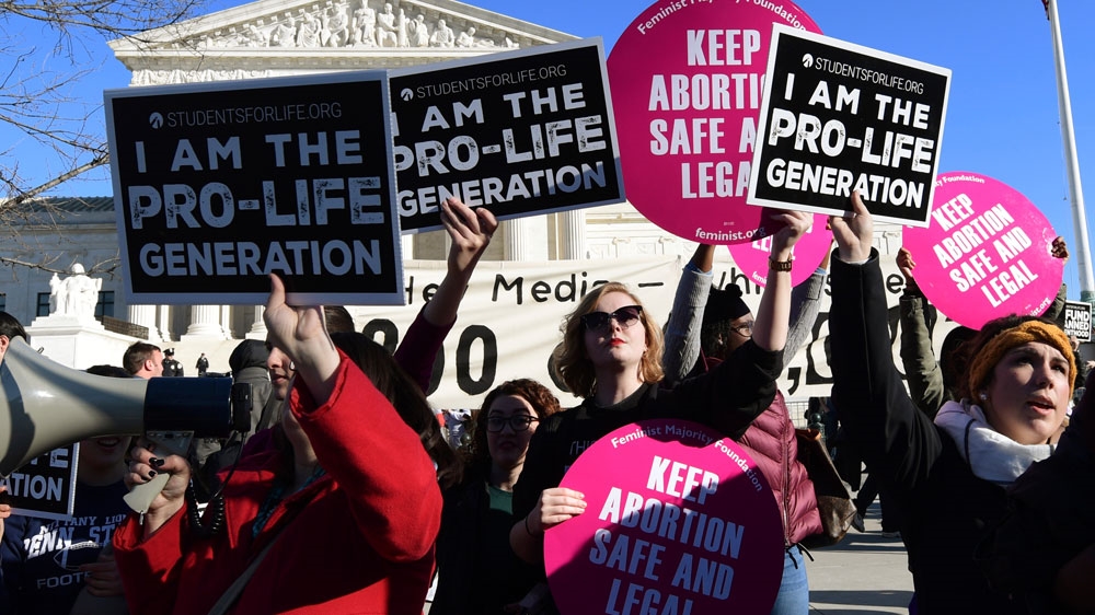 Protesters on both sides of the abortion issue gather outside the Supreme Court during the March for Life [Susan Walsh/AP Photo]